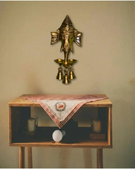 Brass Ganesha hanging with small diya and bells