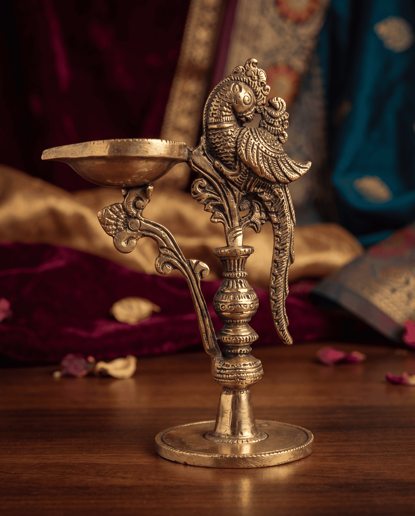 Long diya with peacock