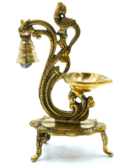 Beautifully carved brass diya with lamp and bell