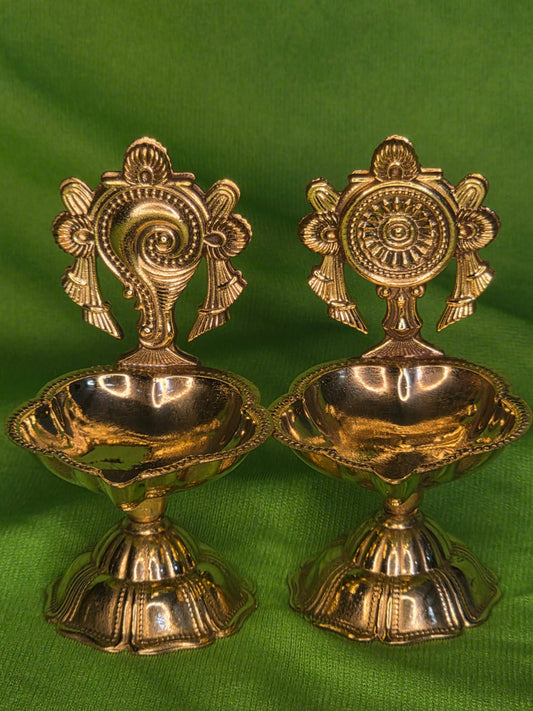 Beautiful and auspicious pair of shaku chakra diyas