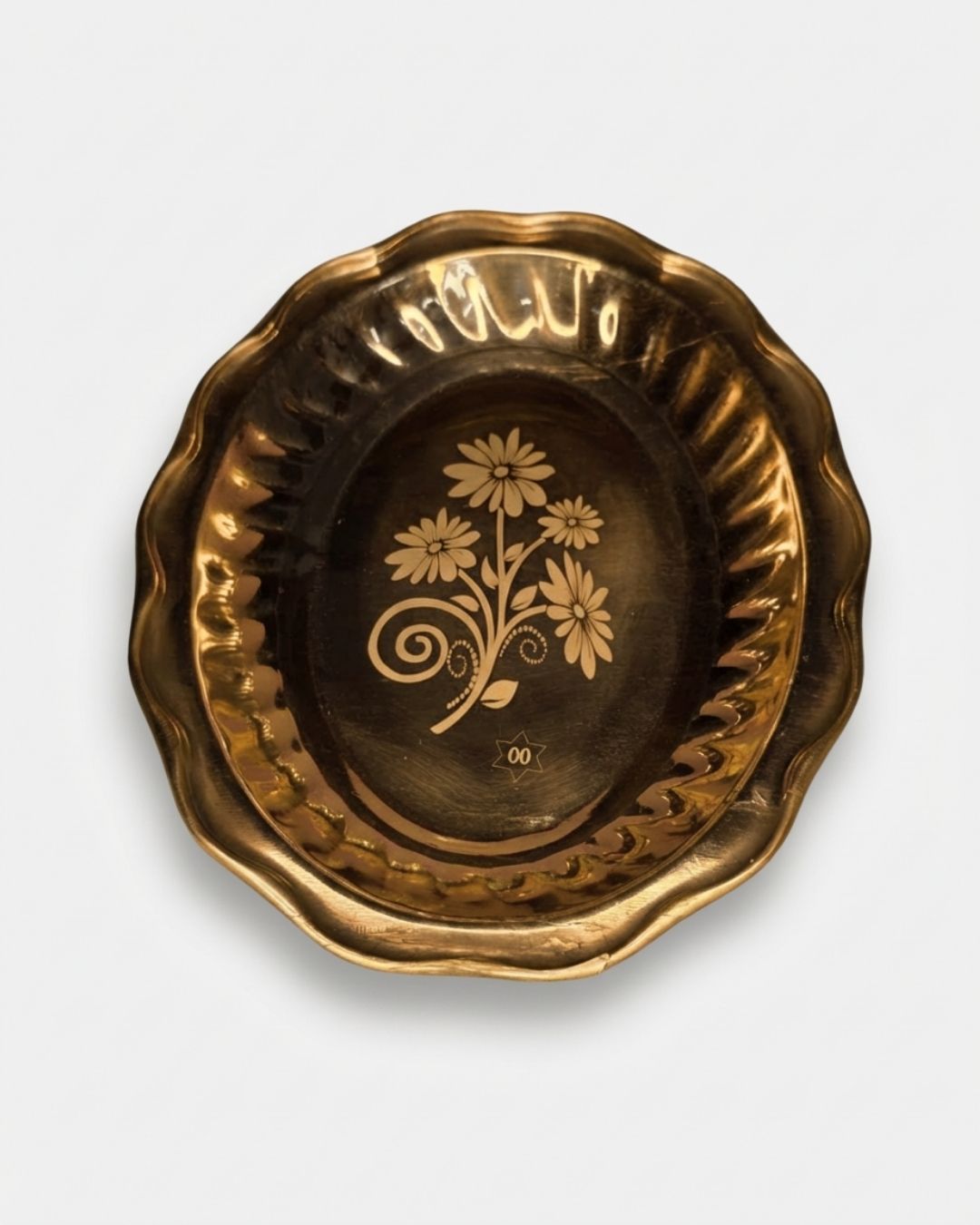 Graceful brass plate in oval shape with flower laser print in the middle