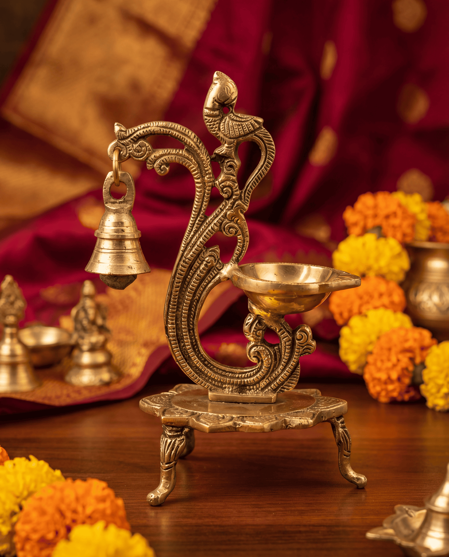 Beautifully carved brass diya with lamp and bell - 6.7 Inches Height