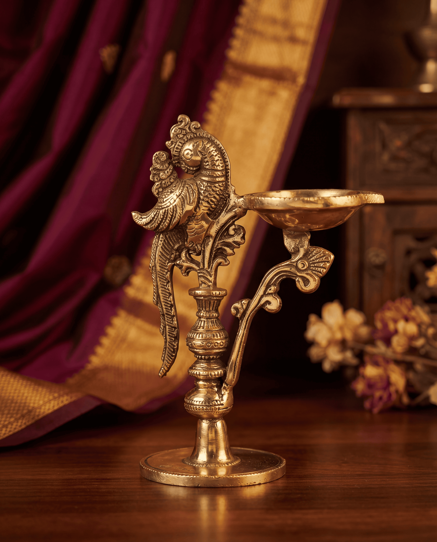 Long diya with peacock