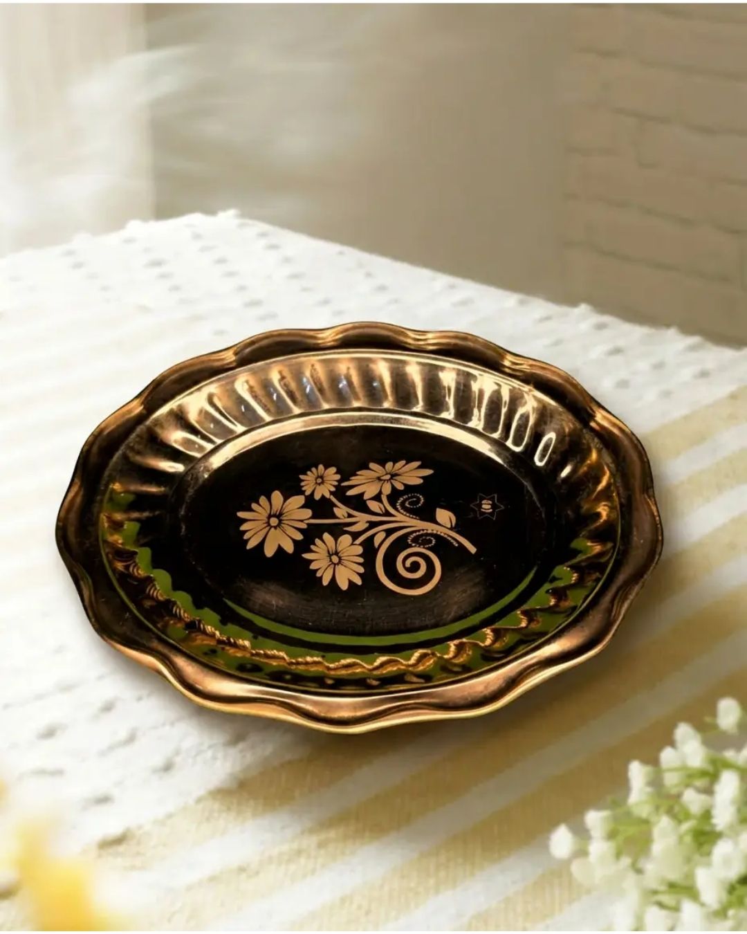 Graceful brass plate in oval shape with flower laser print in the middle