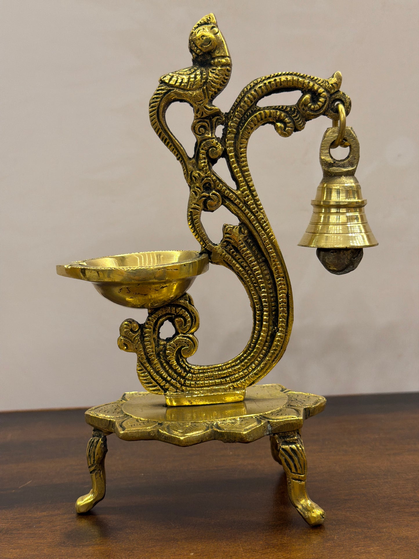 Beautifully carved brass diya with lamp and bell - 6.7 Inches Height