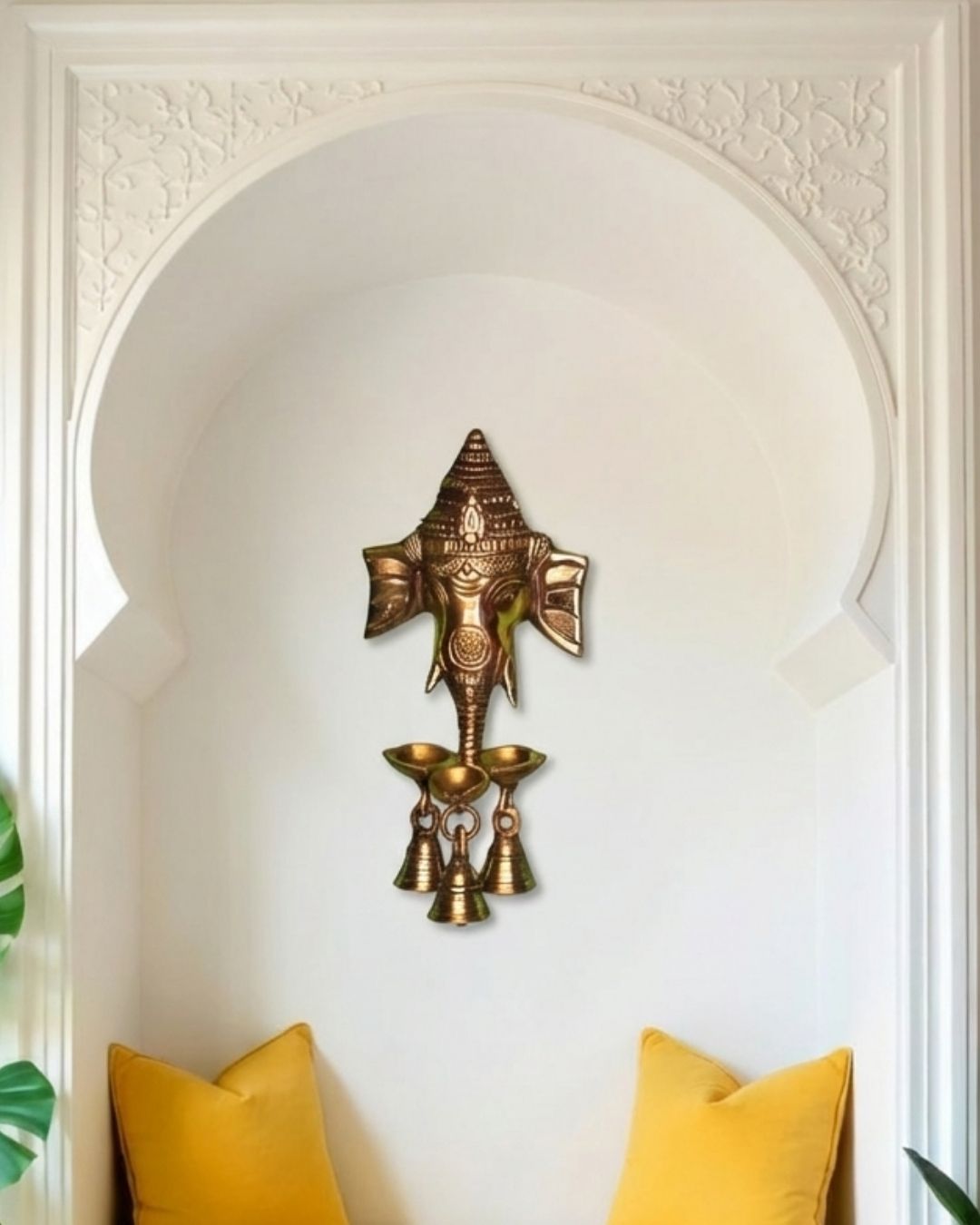 Brass Ganesha hanging with small diya and bells