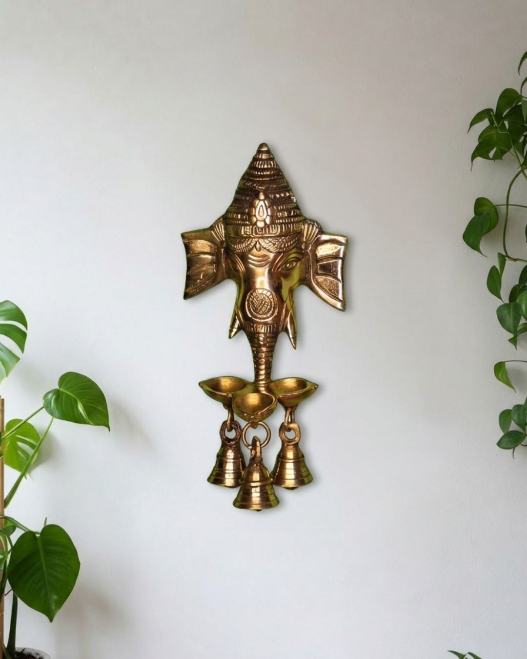 Brass Ganesha hanging with small diya and bells
