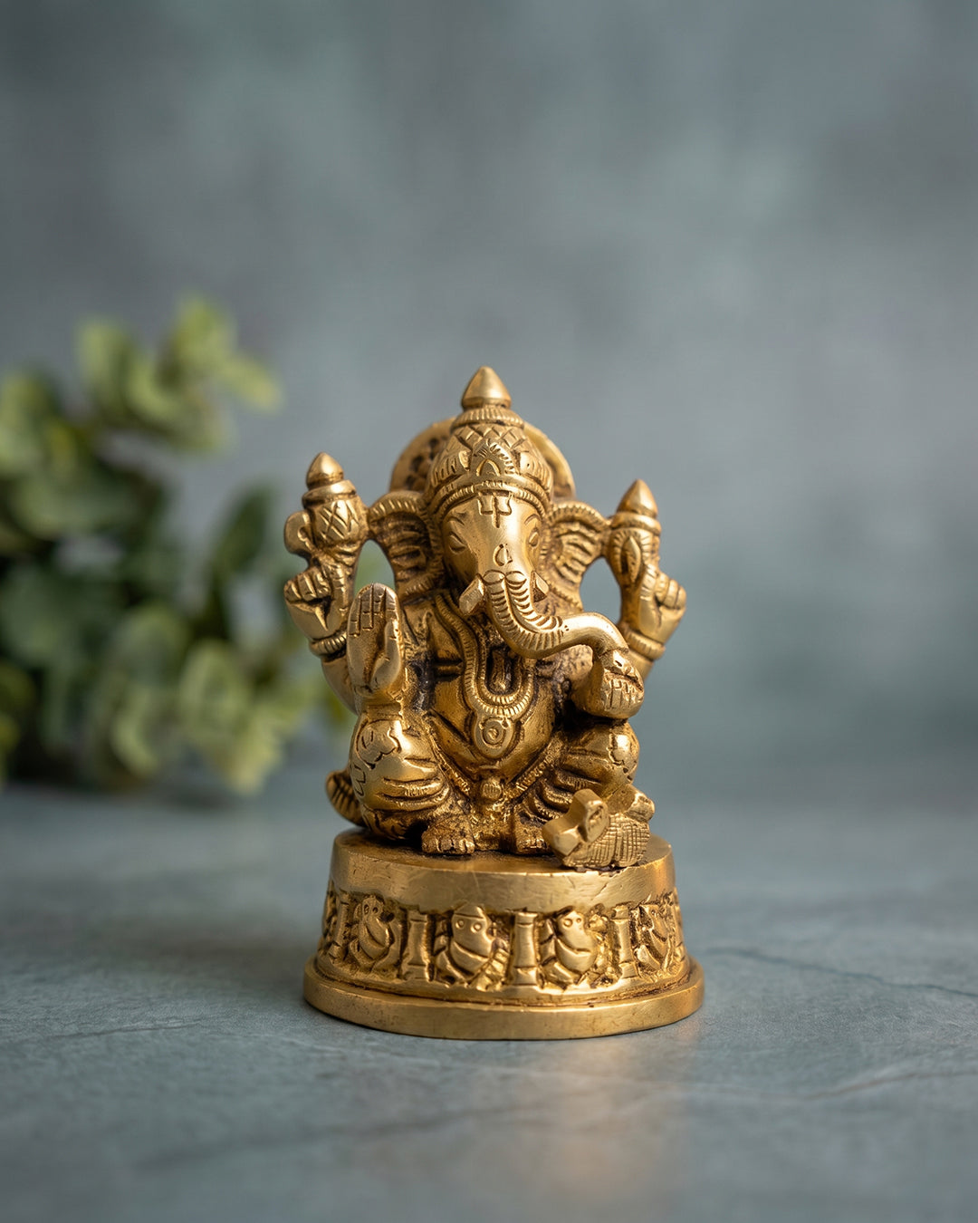 Ganesha Sitting on Base – 3 Inches Gold Finish Idol