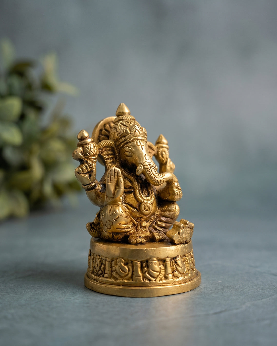 Ganesha Sitting on Base – 3 Inches Gold Finish Idol