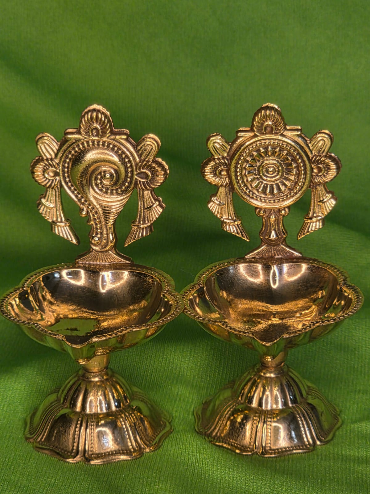 Beautiful and auspicious pair of shaku chakra diyas