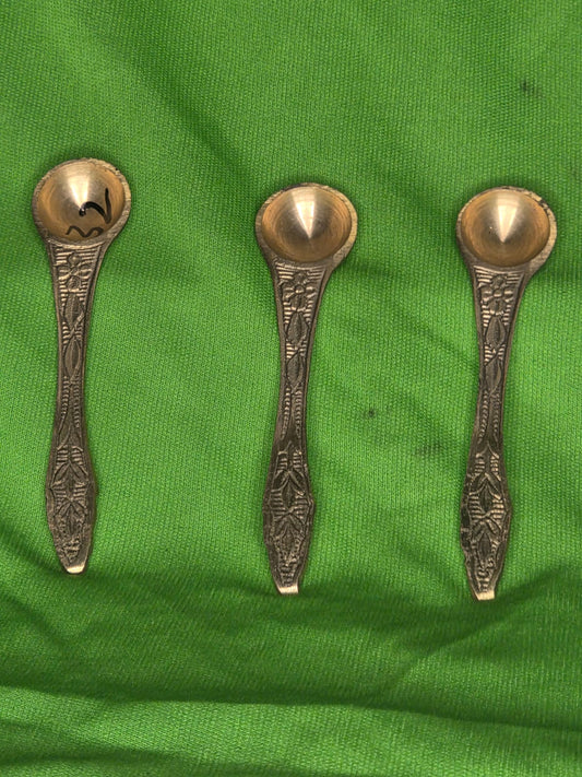 Brass spoons with design